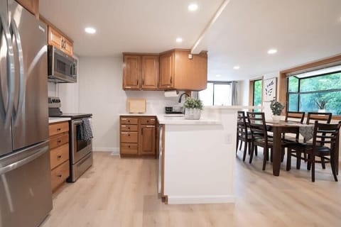 "Indulge in culinary delights as the chef's kitchen seamlessly flows into the dining area