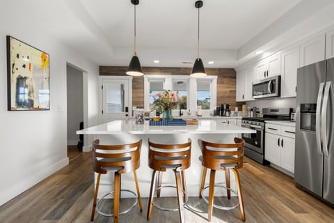 Open concept kitchen w/tons of amenities, and a large island for three.