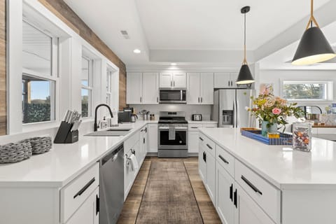 Open concept kitchen w/tons of amenities, and a large island for three.