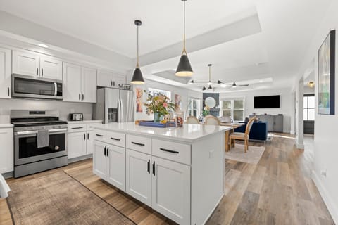 Open concept kitchen w/tons of amenities, and a large island for three.