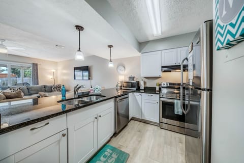 The fully equipped kitchen features granite countertops, stainless-steel appliances, and has everything you need to prepare meals for family and friends.