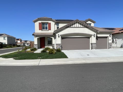 Front house.  3-car garage.  EV level 2 charger available.