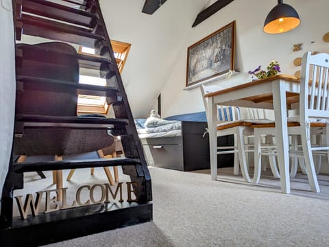 Entrance to the room from the stairway from downstairs