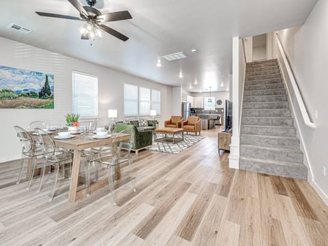 “Step into a realm of chic comfort with our spacious living area, where modern decor meets homely warmth, perfect for creating unforgettable moments.”