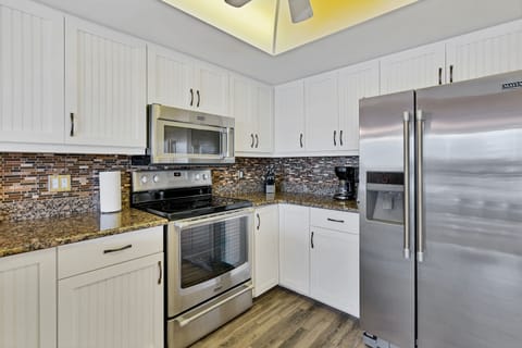 Coffee maker, toaster, dishes and utensils ready to use.