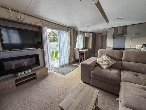 Cozy living room with fireplace and scenic patio access