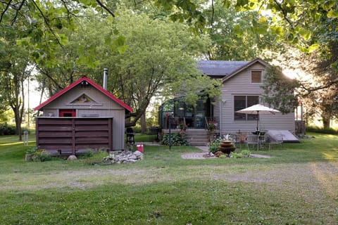View of sauna and farmhouse.