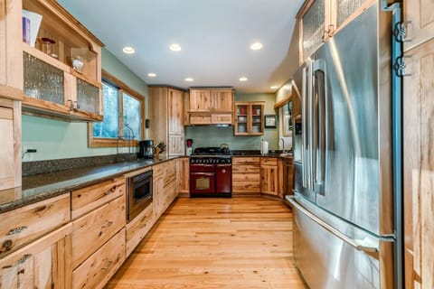 Spacious, open kitchen featuring gorgeous cabinets and granite countertops