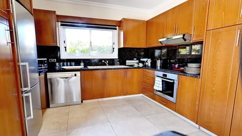 Fully fitted kitchen with the expected utilities, including dish washer, microwave, cooker, oven and fridge freezer.