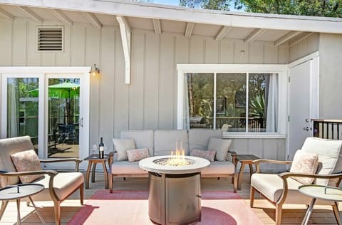 Enjoy a glass of wine with friends & family around the firepit.