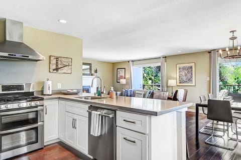 Cook a meal while being part of the conversation with guests in the living room.