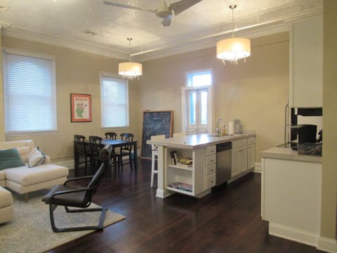 Bright open-concept kitchen and dining area with a large island, modern appliances, and cozy dining space for shared meals.