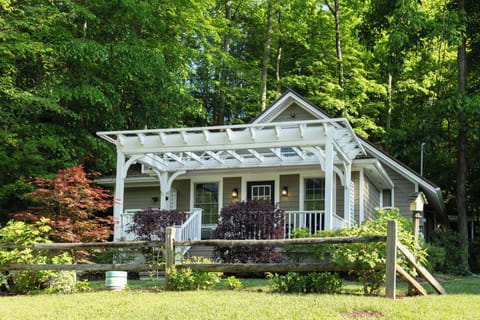 The home is surrounded by beautiful landscaping and tucked back into the trees.