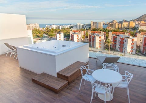 Rooftop hot tub area offering stunning views of the surrounding cityscape.