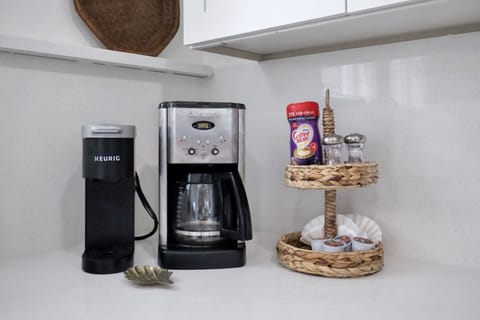 Fuel your day with our fully stocked kitchen, complete with all the essentials and a little extra love – including your choice of a classic drip coffee pot or a convenient single cup coffee maker. Because mornings are better with the perfect brew, and we've got you covered! ☕🍳 #KitchenPerfection #CoffeeLoversDream #TybeeIsland #LuxuryVacation #BeachRetreat #WesterlyGuild #Anchoredon8