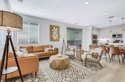Open floor plan living room area, dining and kitchen area