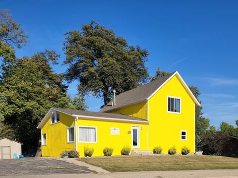 This is the front yard view of Stay Cabin along Hwy 71 in Arnolds Park Iowa. The green building to the north, is the Stay Cottage and is available to rent separately. 