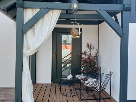 Porch seating and privacy outdoor curtains