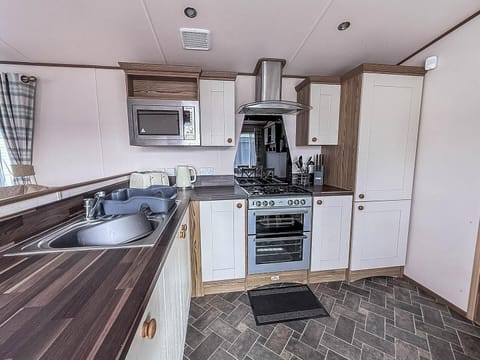 Modern kitchen with sleek appliances and ample counter space