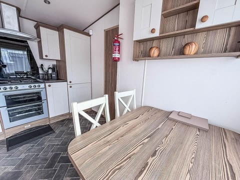 Cozy kitchen and dining area with rustic charm and modern amenities
