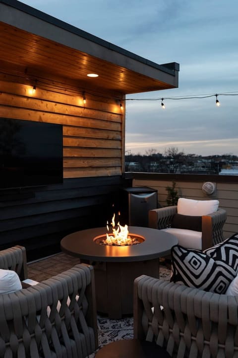 Rooftop views with a warm fire.