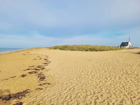 Direct access to the untouched dunes from your doorstep for an exceptional beach experience.