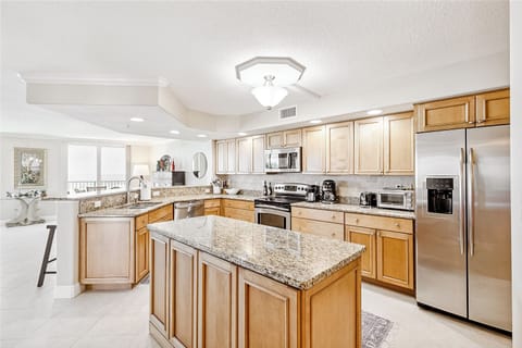 Cook and entertain in style with a spacious, wide-marbled countertop kitchen—sleek, modern, and perfect for every meal!
