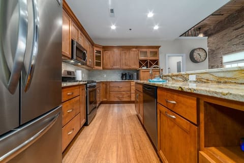 Gorgeous fully stocked kitchen with oversized island, full sized appliances and seating for 5 at the bar.