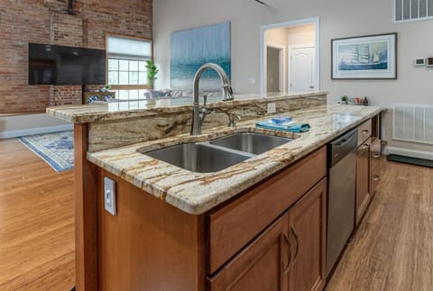 Gorgeous fully stocked kitchen with oversized island, full sized appliances and seating for 5 at the bar.