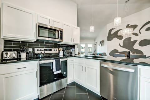 From the kitchen, enjoy a seamless sightline to the entire living area.