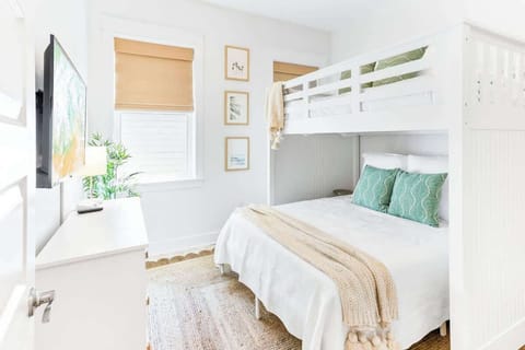 Bedroom #1 features a full over queen bunk and smart tv.