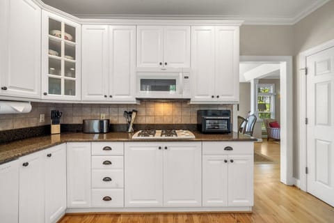 Kitchen is outfitted with a Gas Cooktop