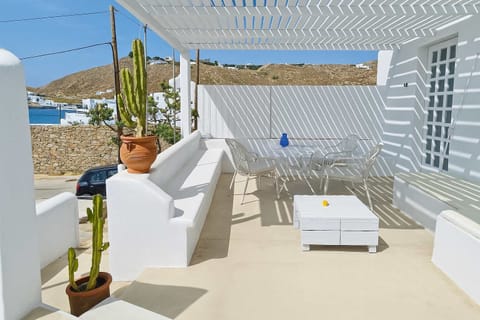 Shaded Private Patio with Seating and Sea View

