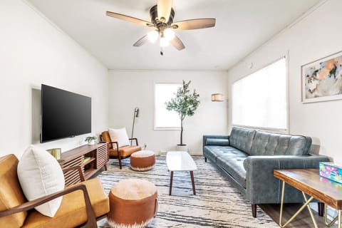 Chic mid-century living space with a comfy sofa and lots of natural light.