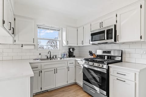Fully equipped kitchen with modern appliances.
