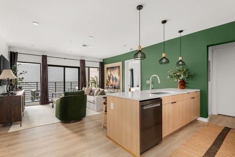 Entrance way that looks into kitchen and living room