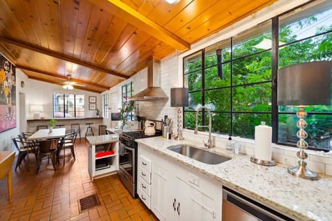 The kitchen is full of windows. with a great view out onto the courtyard.