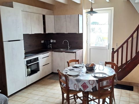 Furniture, Kitchen, Kitchen Appliance, Flooring, Major Appliance, Interior Design, Countertop, Wood, Floor, Cabinetry