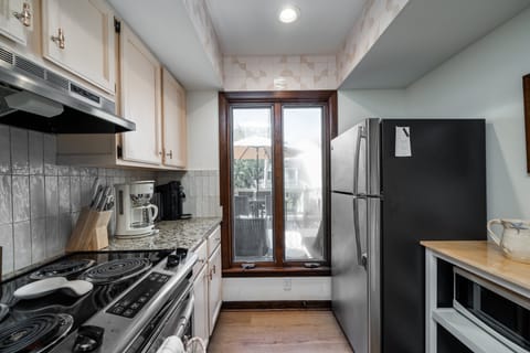 The kitchen window opens to the front deck