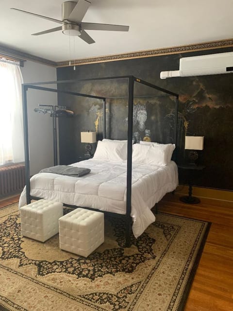 Gorgeous Bedroom with original artwork from some of the history of the row house