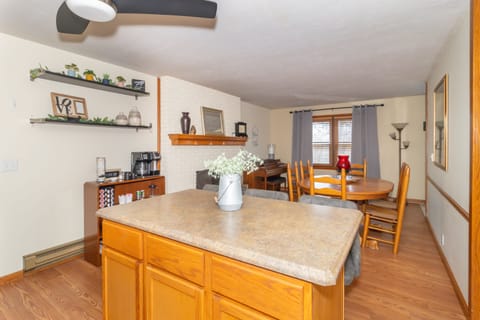 Dining area with fireplace, coffee bar and piano