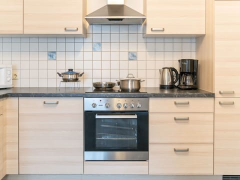 Cabinetry, Countertop, Property, Kitchen, Kitchen Stove, Drawer, Kitchen Appliance, Tap, Interior Design, Flooring