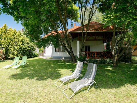 Plant, Property, Tree, Nature, Building, Shade, Natural Landscape, Sky, Outdoor Furniture, Land Lot