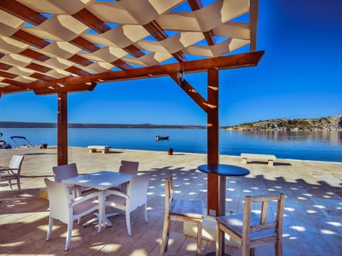 Water, Sky, Furniture, Property, Blue, Table, Shade, Azure, Chair, Outdoor Furniture