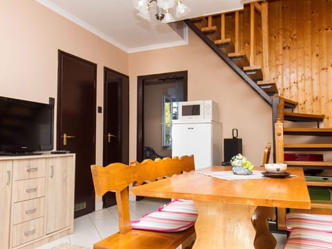 Cabinetry, Table, Furniture, Property, Building, Wood, Interior Design, Lighting, Orange, Floor
