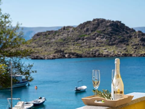 Water, Boat, Sky, Water Resources, Mountain, Vehicle, Azure, Lake, Watercraft, Coastal And Oceanic Landforms