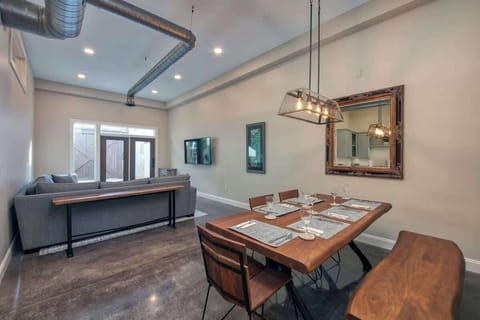 Dining area with wooden table and modern lighting