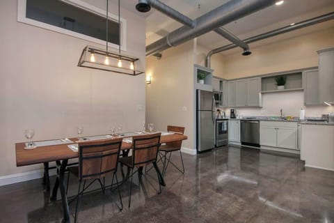 Dining area connected to kitchen and living space