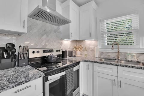 Discover the joy of cooking in our stylish modern kitchen, designed to inspire and enhance your culinary creations.