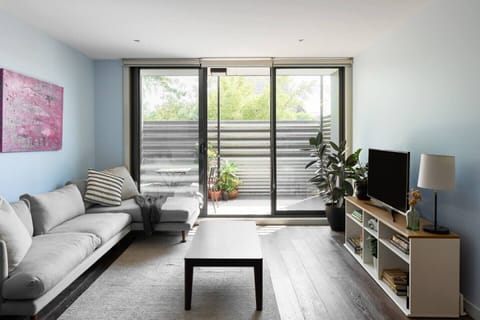 Settle into the inviting living area before stepping out to the balcony for a serene outdoor retreat.